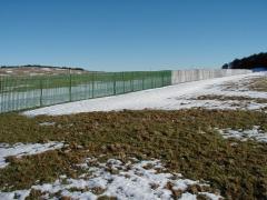 Extruded plastic snowdrift barrier